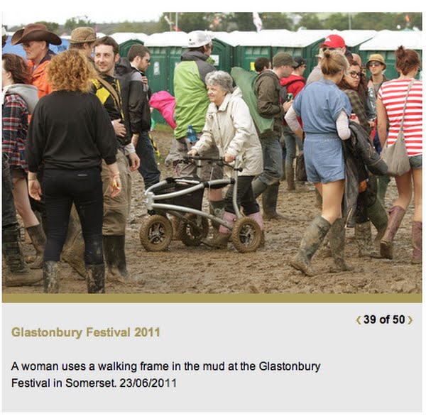 Infirm Woman in a wheelchair at a festival Actual Size Image